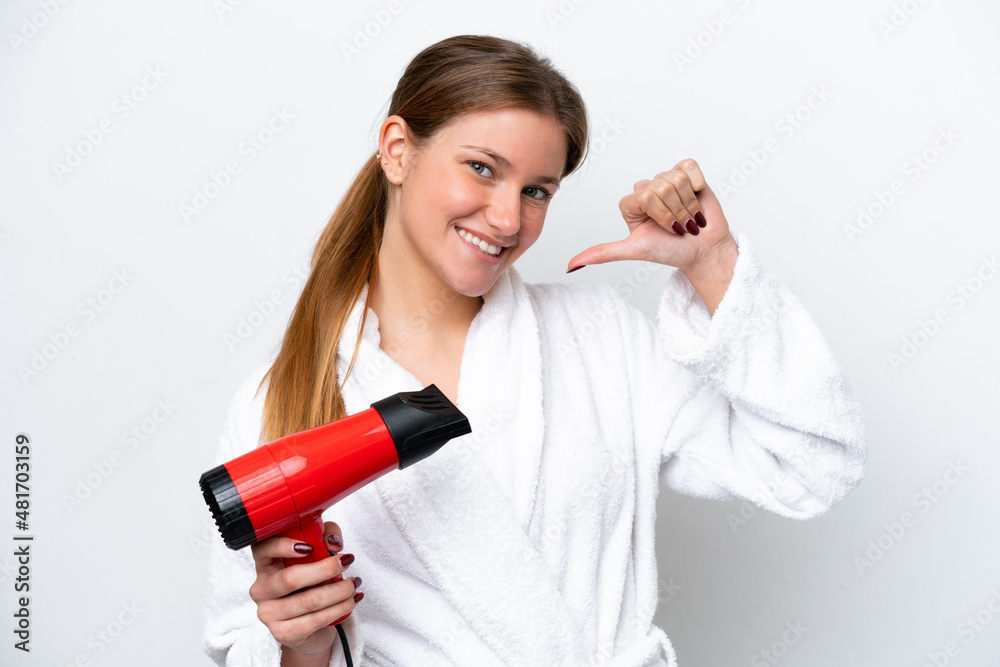 Young caucasian woman holding hairdryer isolated on white background proud and self-satisfied Young caucasian woman holding hairdryer isolated on white background proud and self-satisfied