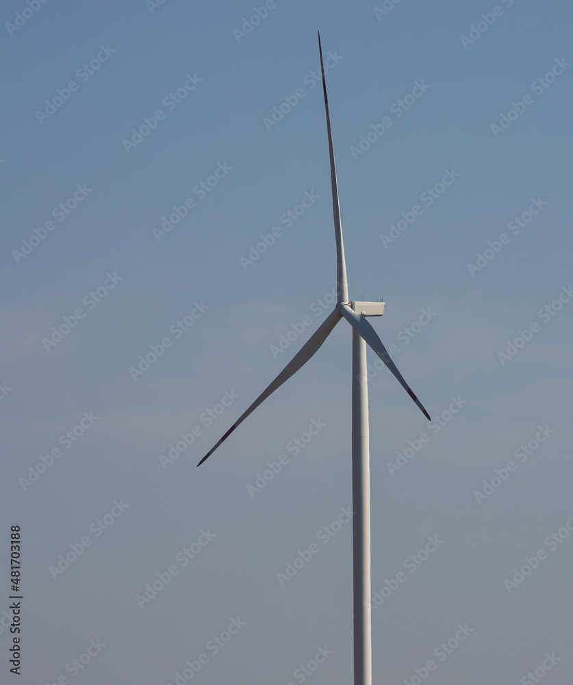 wind mill or also wind-turbine on wind farm in rotation to generate electricity energy on outdoor with sun and blue sky, conservation and sustainable energy concept wind mill or also wind-turbine on wind farm in rotation to generate electricity energy on outdoor with sun and blue sky, conservation and sustainable energy concept