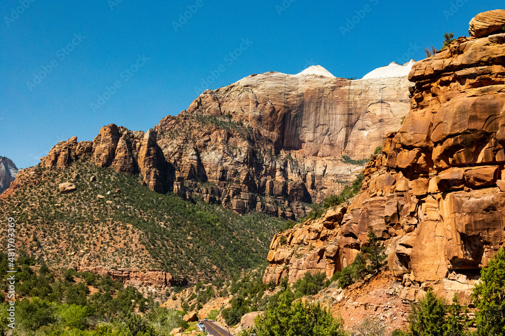 Canyons with vibrant oranges, reds, and whites