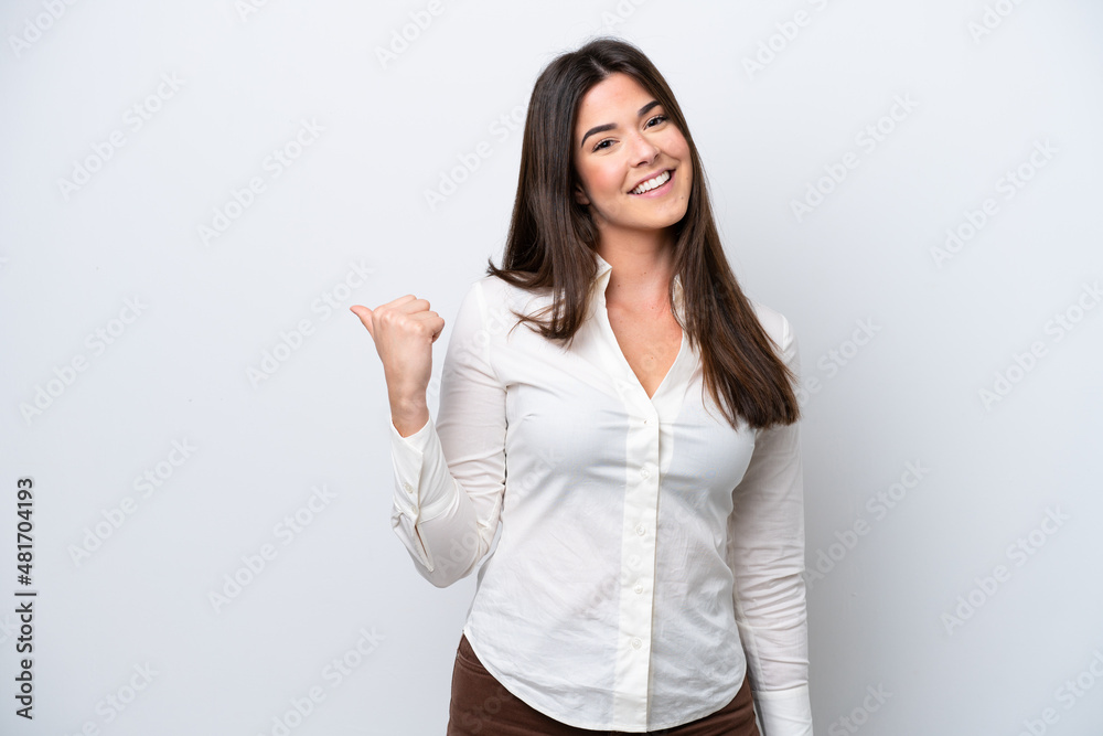 Young Brazilian woman isolated on white background pointing to the side to present a product Young Brazilian woman isolated on white background pointing to the side to present a product