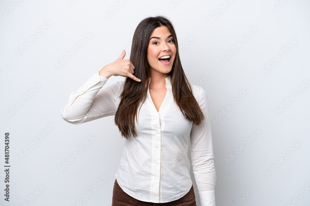 Young Brazilian woman isolated on white background making phone gesture. Call me back sign Young Brazilian woman isolated on white background making phone gesture. Call me back sign