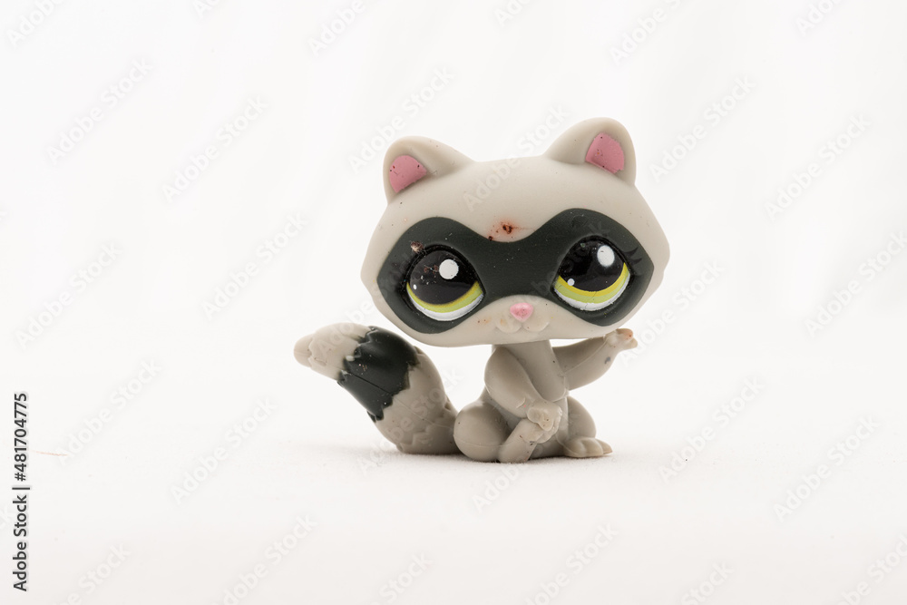 Small plastic racoon toy figure.