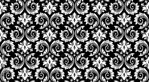 Wallpaper in the style of Baroque. Seamless vector background. White and black floral ornament. Graphic pattern for fabric, wallpaper, packaging. Ornate Damask flower ornament