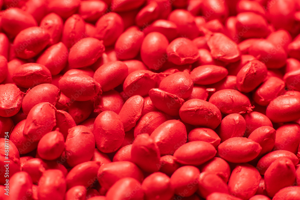 Red polymer dye in granules, background texture Red polymer dye in granules, background texture