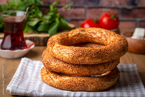 Turkish fast food bagel called Simit. Turkish bagel Simit with sesame. Bagel is traditional Turkish bakery food. Turkish name; simit - gevrek photo