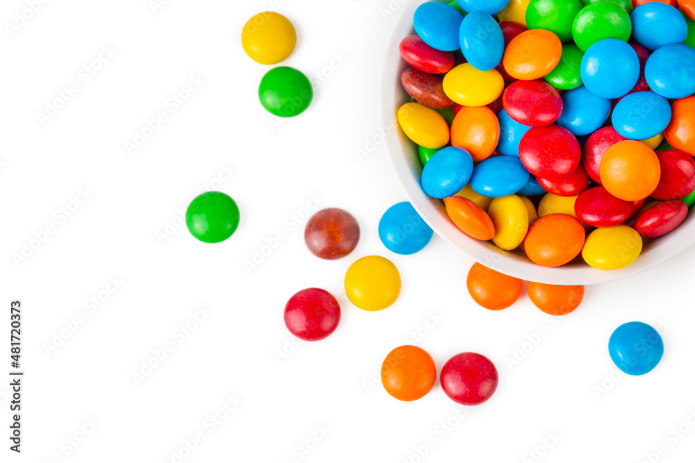 Colorful chocolate buttons on a white background