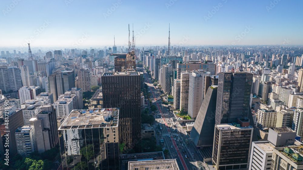 Fototapeta premium Aerial view of Av. Paulista in São Paulo, SP. Main avenue of the capital. With many radio antennas, commercial and residential buildings. Aerial view of the great city of São Paulo.