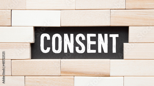 Foto Red color inserted label banner with word consent on white background