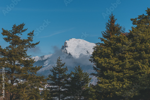 A picturesque landscape view of the French Alps mountains on a cold winter day (La Joue du Loup, Devoluy) photo