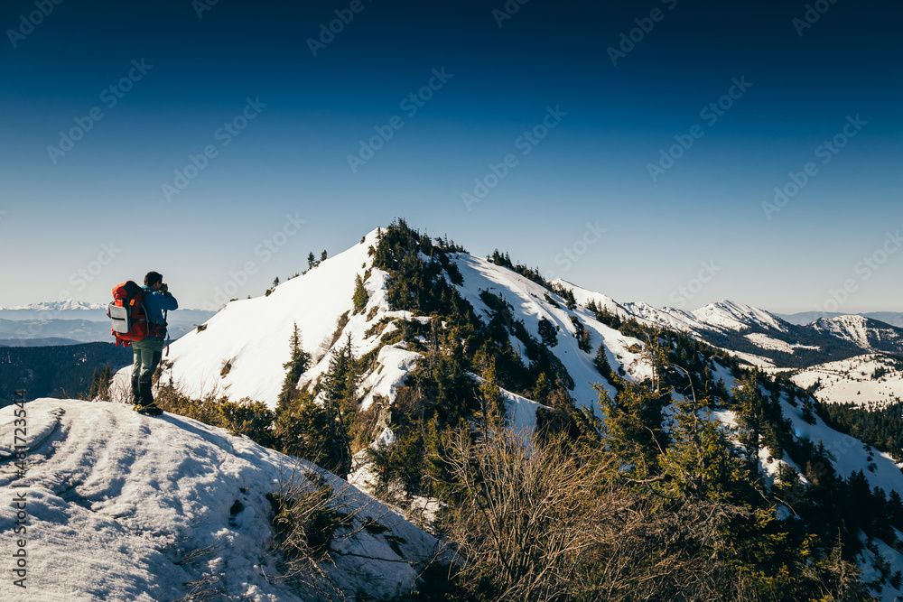 Mountains, coniferous forest in the snow, tourist, spring, winter