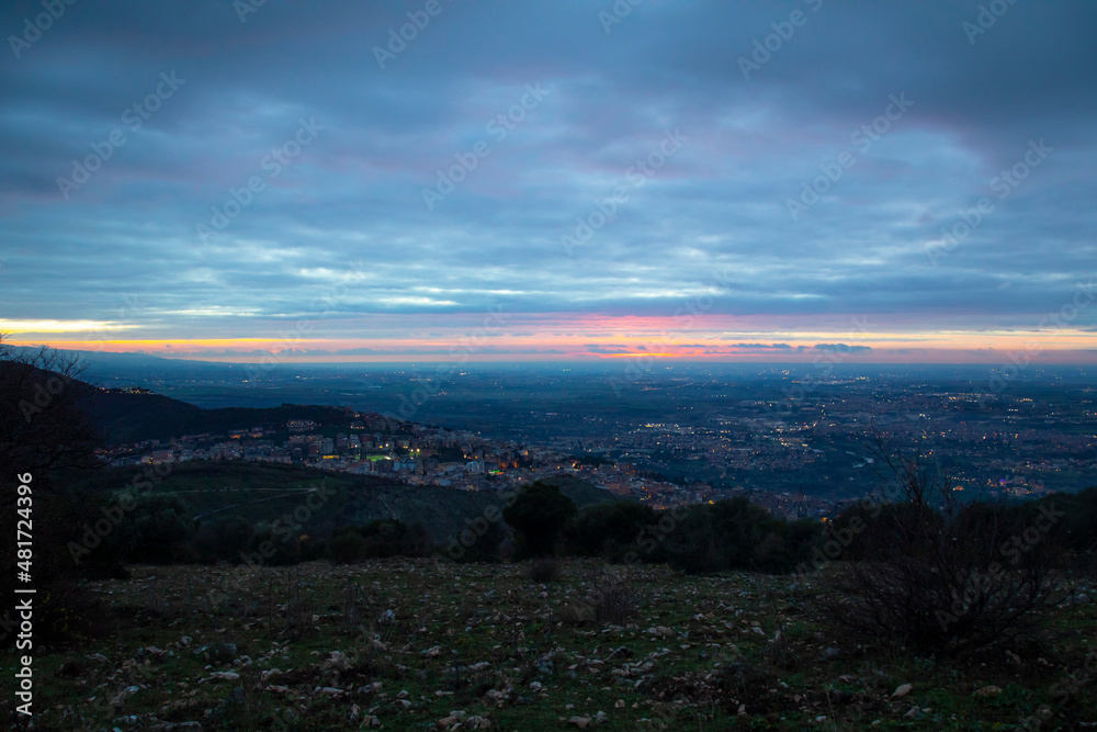 colorful sunset over the city view from the mountain