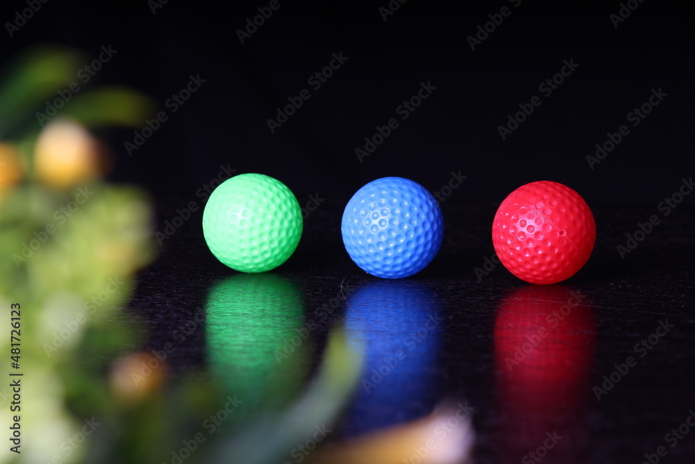 colorful golf ball on table colorful golf ball on table