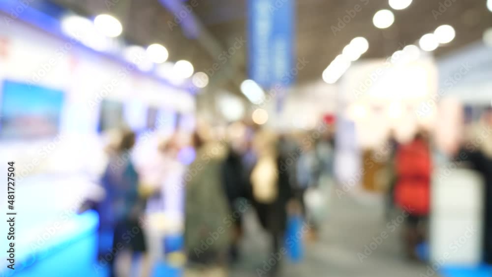Trade show or expo fair full of people in the convention center. Out of focus blurry room with crowd of business people or shopping mall visitors. Busy exhibition hall, lots of people walking around Trade show or expo fair full of people in the convention center. Out of focus blurry room with crowd of business people or shopping mall visitors. Busy exhibition hall, lots of people walking around