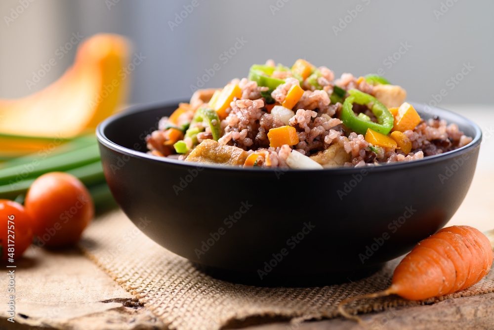 Fried purple rice with tofu, carrot, pumpkin and chili pepper. Healthy Asian vegan food Fried purple rice with tofu, carrot, pumpkin and chili pepper. Healthy Asian vegan food