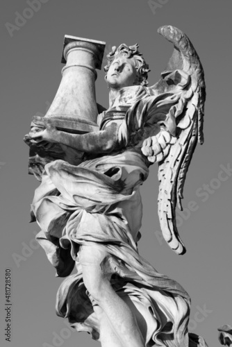 ROME, ITALY - SEPTEMBER 1, 2021: The Angel with the column on the Ponte Sant'Angelo by Antonio Raggi (1624 - 1686).