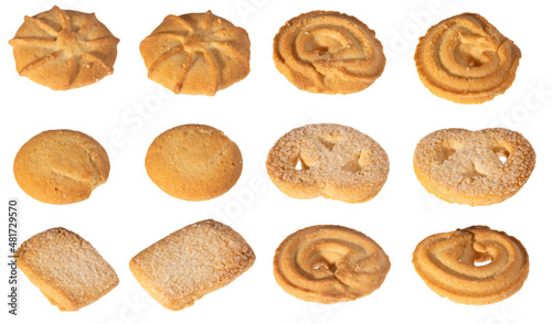 Assorted various forms of danish crumbly cookies isolated on white. Shooting angle 45 degrees, harsh light from the left. 