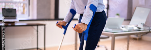 Canvastavla Worker With Crutches At Workplace Or Office
