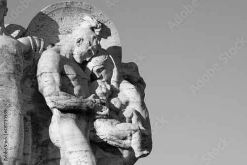 ROME, ITALY - SEPTEMBER 1, 2021: The detail of Il Valore Militare marble sculpture on the Ponte Vittorio Emanuele II bridge bridge by Italo Orlando Griselli (1910). photo