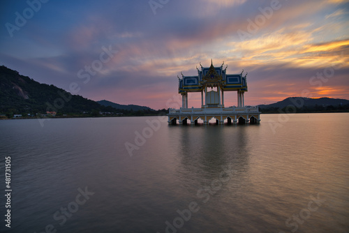 Buddhist Shrine On A Lake In Hua Hin In Thailand At Sunset! The Temel is reflected in the water and the sky turns red!