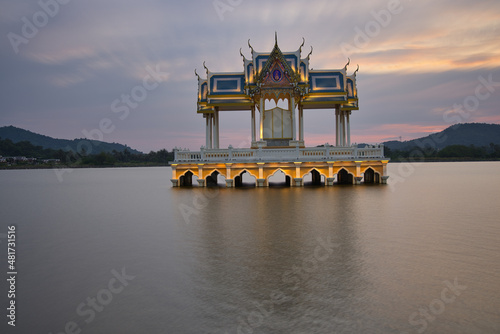 Buddhist Shrine On A Lake In Hua Hin In Thailand At Sunset! The Temel is reflected in the water and the sky turns red!