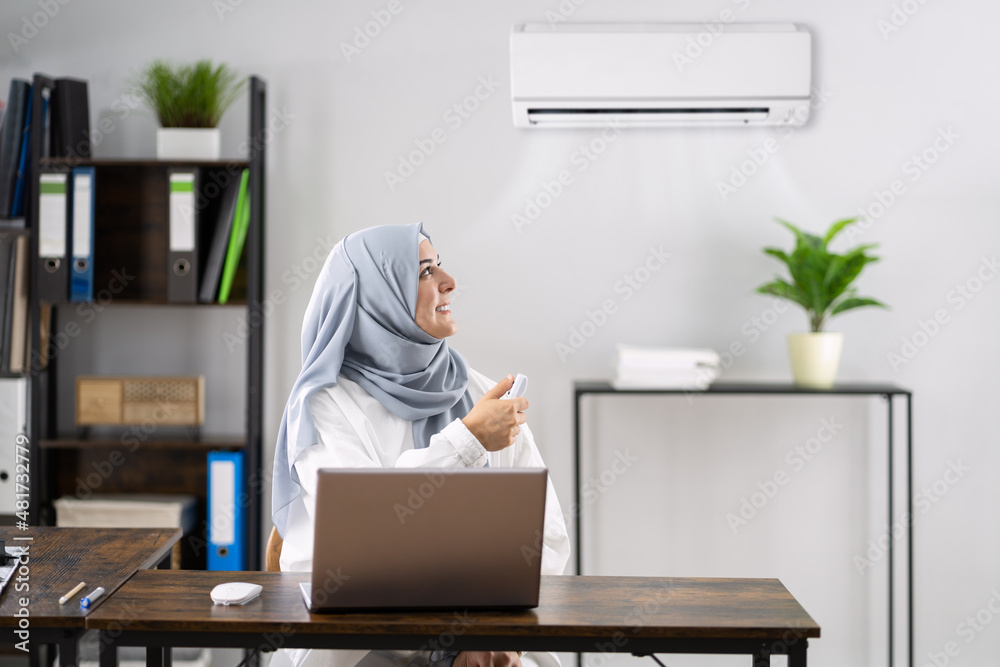 Happy Muslim Woman Working In Office Happy Muslim Woman Working In Office