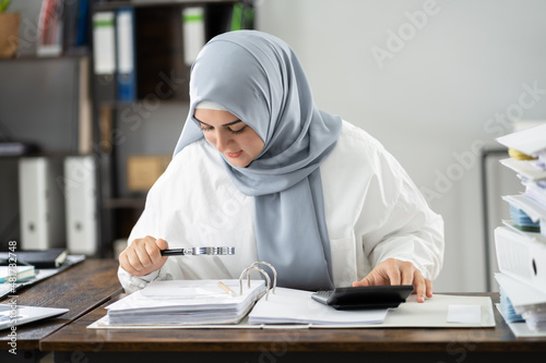 Muslim Auditor Woman Doing Fraud Audit