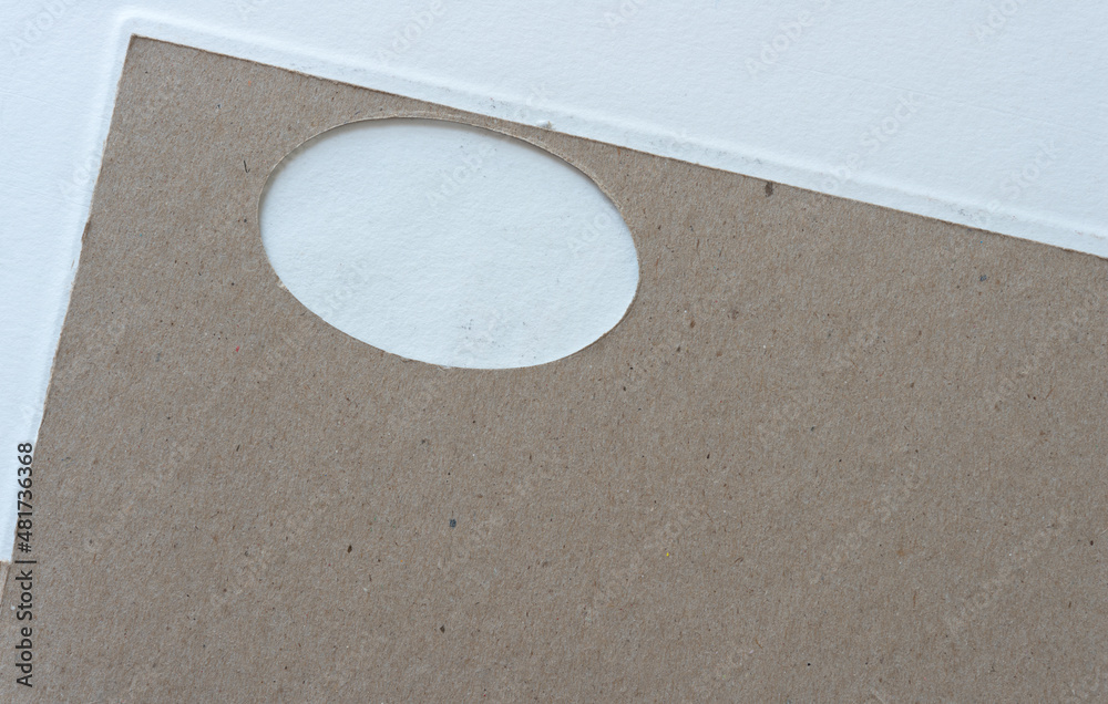 Obraz premium cardboard with oval window on a light background