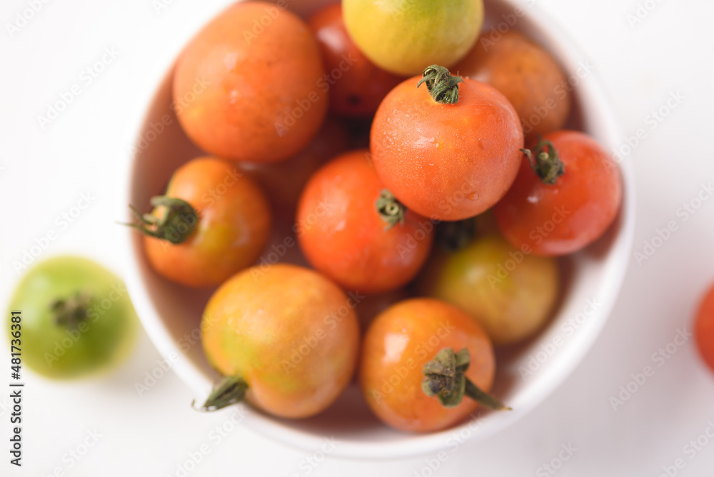 Fresh tomato on white background. Organic vegetable from Thai farmer in local market Fresh tomato on white background. Organic vegetable from Thai farmer in local market