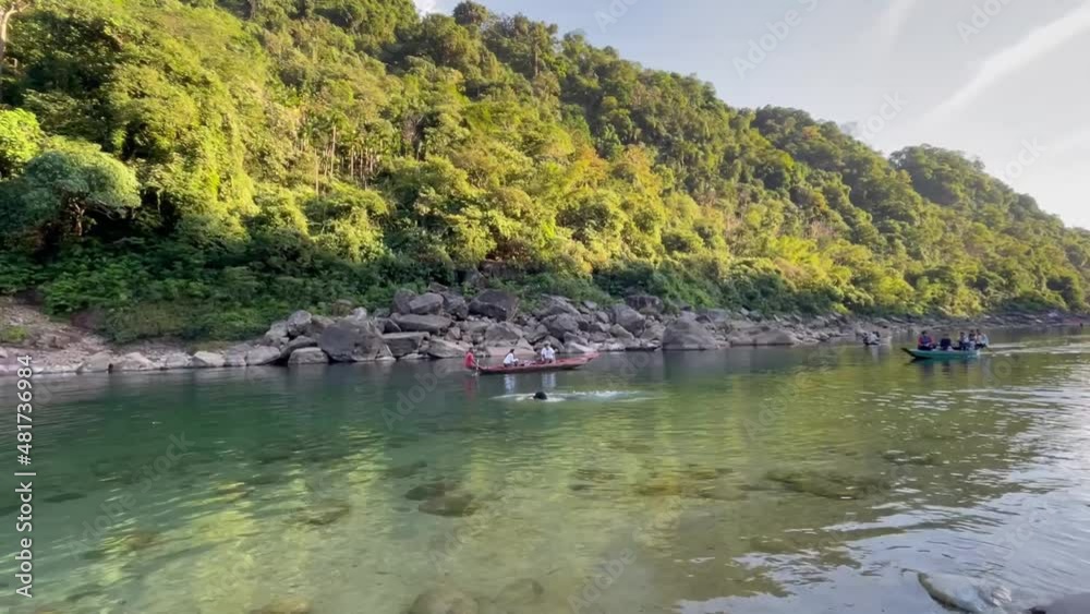 Swimming And Boating At Umngot River With Lush Green Forest In Dawki, Meghalaya, India. - wide Swimming And Boating At Umngot River With Lush Green Forest In Dawki, Meghalaya, India. - wide