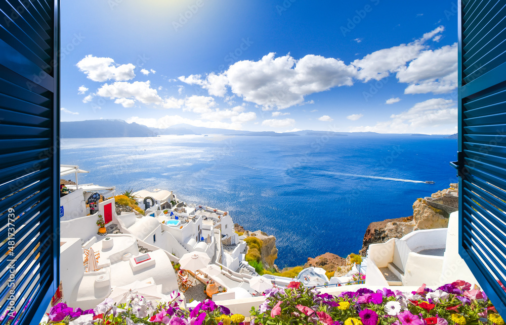 View through an open window with shutters of the caldera, sea and white village of Oia on the island of Santorini, Greece. - obrazy, fototapety, plakaty 