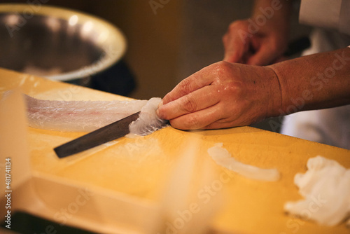 寿司ネタを切る寿司職人 photo