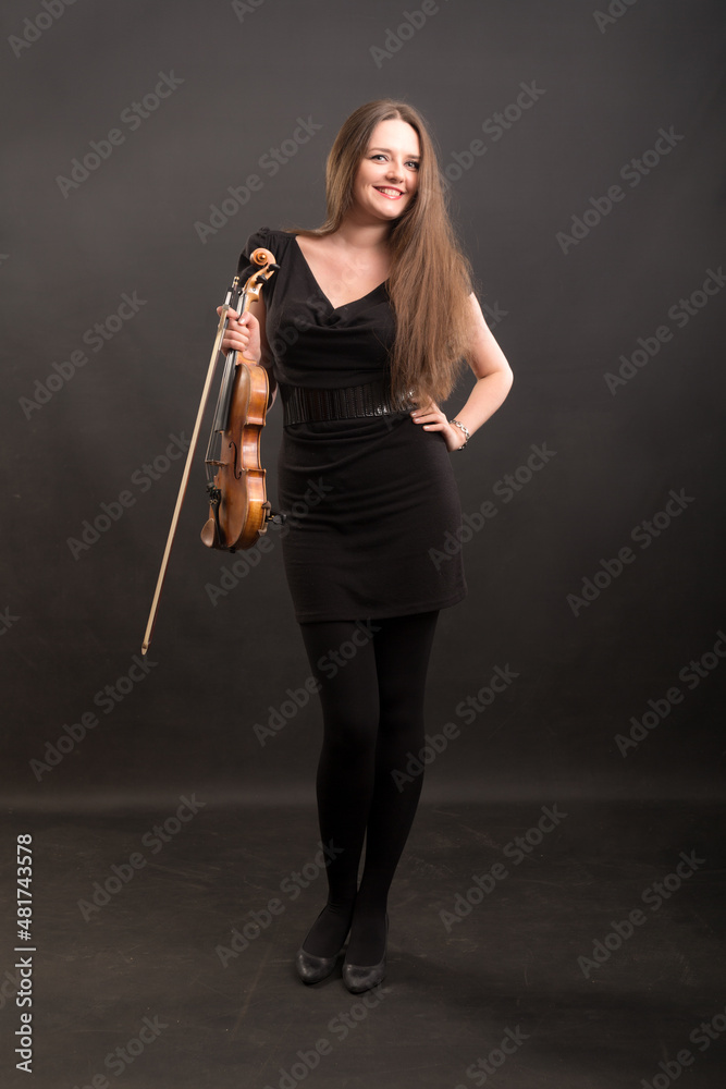 woman in black dress with violin