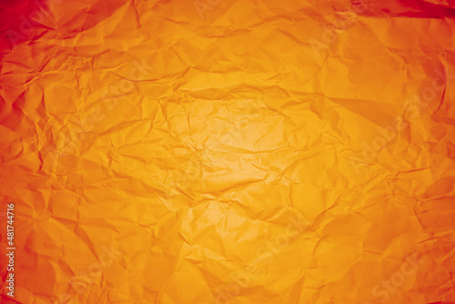 Wrinkled orange and yellow paper for background and texture