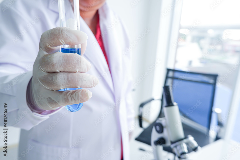 Close up of hand female Scientist holding Test tube in the laboratory. Close up of hand female Scientist holding Test tube in the laboratory.