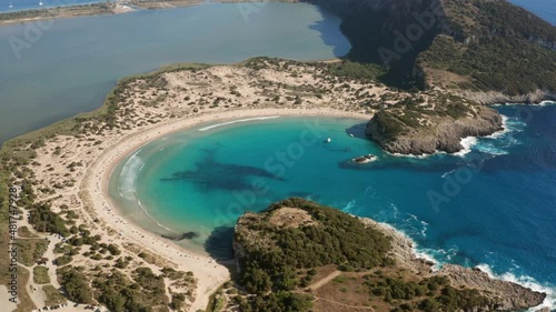 Omega-Shaped Sand Dunes Of Voidokilia Beach In The Mediterranean Area Of Messinia, Greece. aerial photo