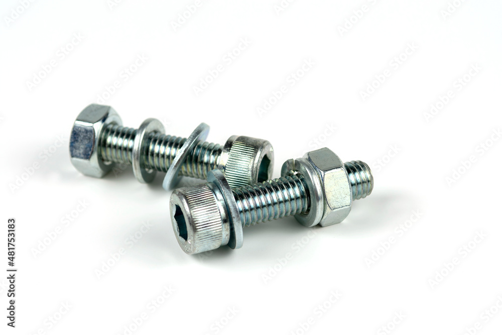 metal bolts and nuts with round washers close-up on a white background metal bolts and nuts with round washers close-up on a white background