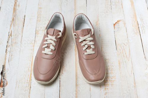 Light brown faux leather shoes with laces. Close-up shot.