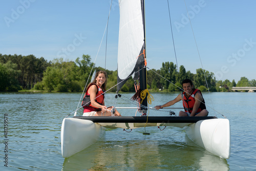 a young couple is sailing away