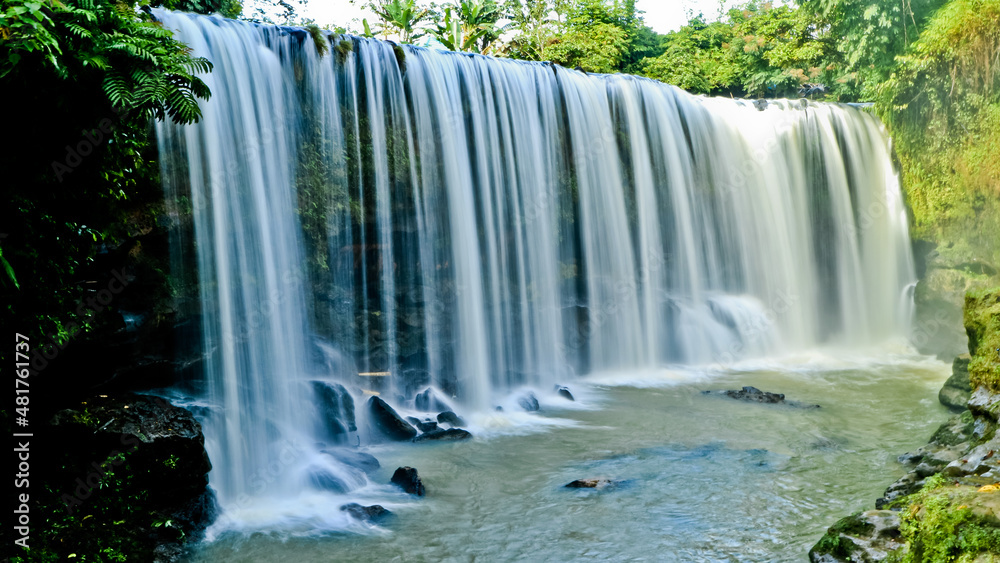 Obraz premium Landscape photo, Temam Waterfall, beautiful waterfall in Lubuk Linggau, South Sumatera province, Indonesia
