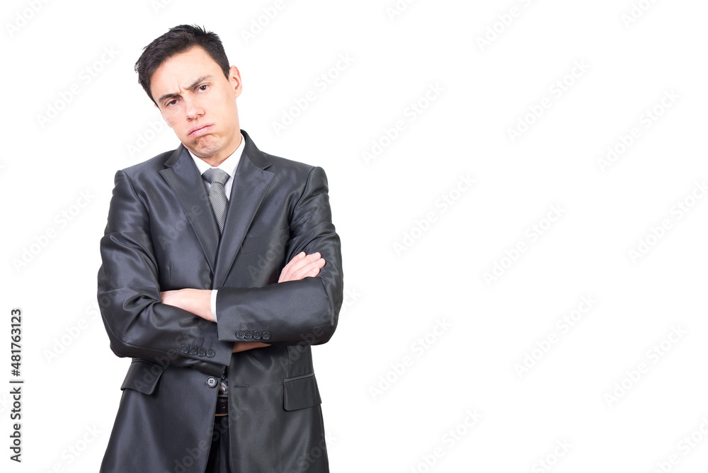 Exhausted young businessman standing with folded arms Exhausted young businessman standing with folded arms