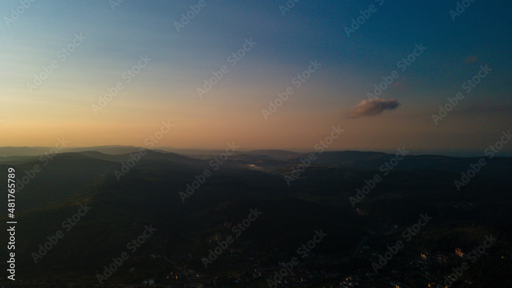 Obraz premium Mountains forest at sunset top view