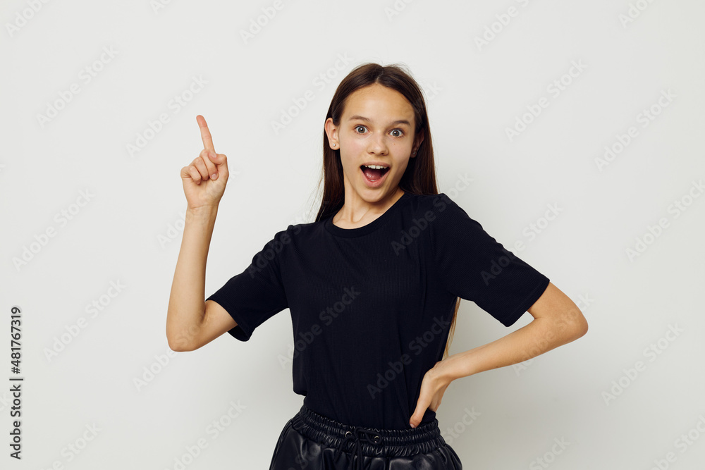 young beautiful woman in a black t-shirt hand gesture fun isolated background