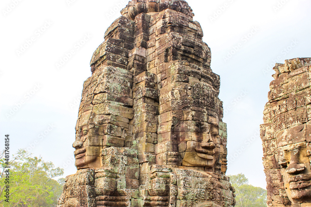 Fototapeta premium Ancient Stone Temple with Smiling Faces in Angkor Wat