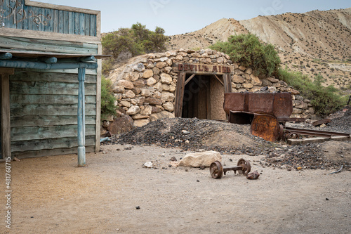 Rusty wagon in the old abandoned gold mine in the old west