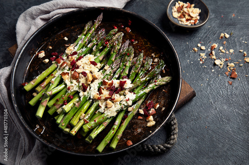 Warm salad with asparagus, cheese, nuts