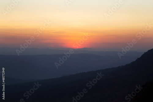 Thailand traveler in happy time with beautiful Sunset at Phu Kradueng National Park in Loei Province of thailand at noise out focus © Thanat