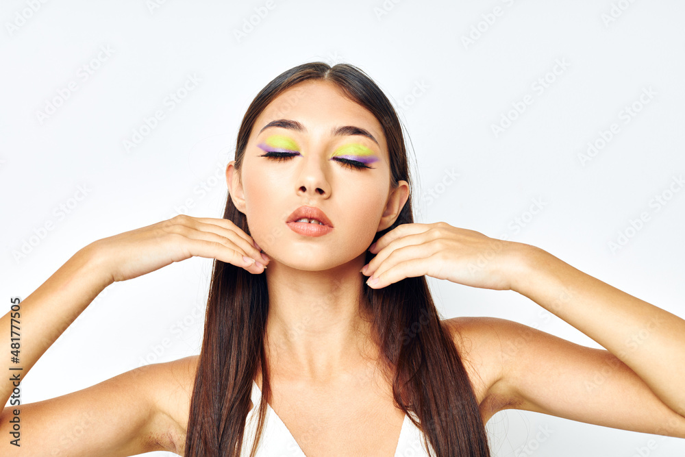 portrait pretty woman long hair cosmetics posing light background unaltered portrait pretty woman long hair cosmetics posing light background unaltered