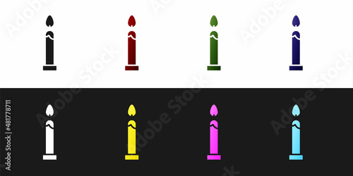Set Burning candle icon isolated on black and white background. Cylindrical candle stick with burning flame. Vector Illustration