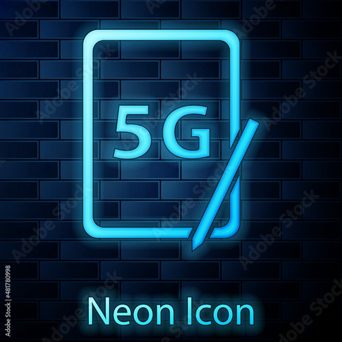 Glowing neon Graphic tablet with 5G wireless internet wifi icon isolated on brick wall background. Global network high speed connection data rate technology. Vector