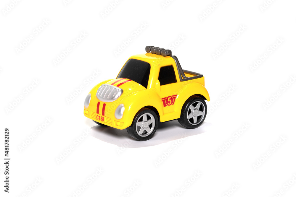 Children yelow toy car isolated on white.